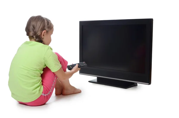 Little girl looks lsd TV — Stock Photo, Image