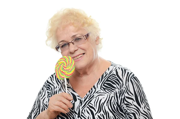 Seniorin mit Zuckerbonbons — Stockfoto