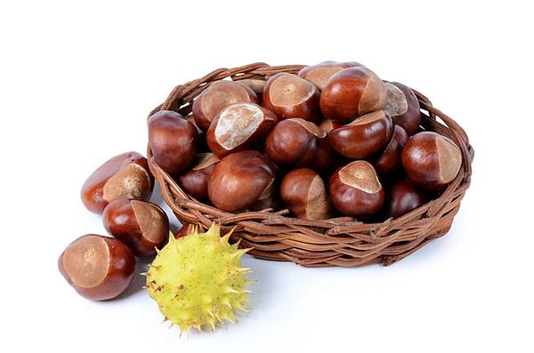Chestnuts in wicker basket — Stock Photo, Image