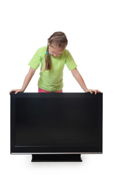 Little girl looks lsd TV — Stock Photo, Image