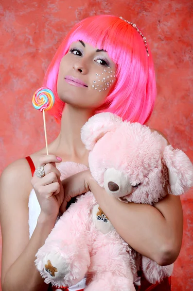 Girl with pink hair holding lollipop — Stock Photo, Image