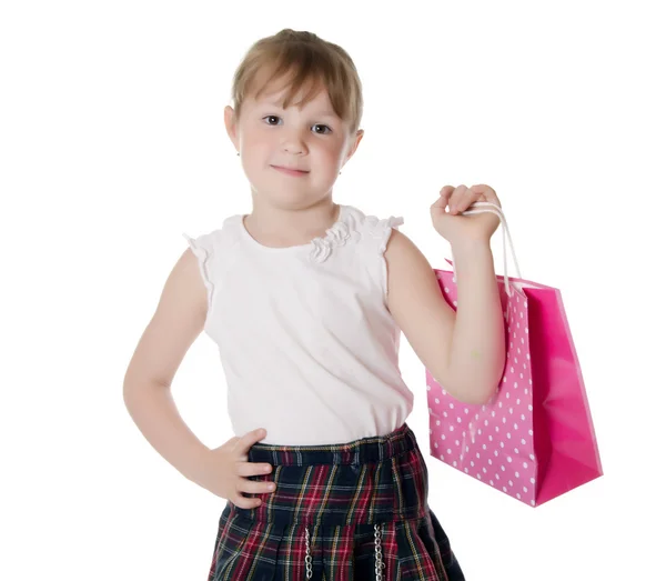 Menina segurando saco de compras rosa — Fotografia de Stock