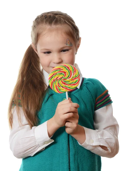 Liten flicka håller Lollipop — Stockfoto