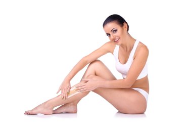 woman depilating her legs