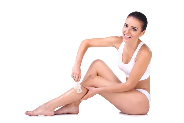 Woman depilating her legs — Stock Photo, Image