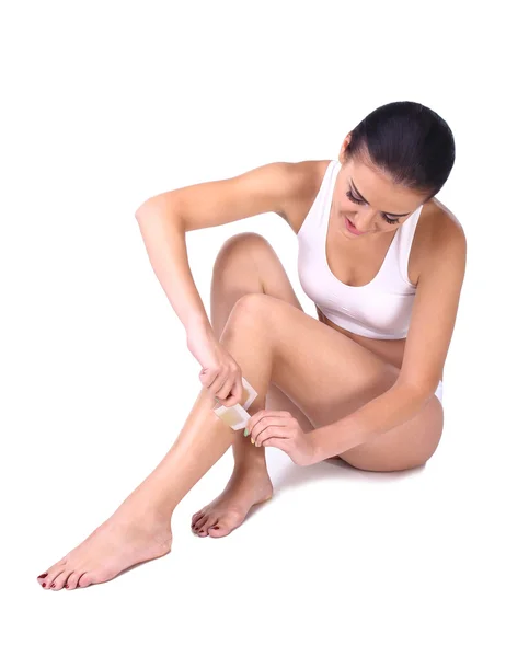 Woman depilating her legs — Stock Photo, Image