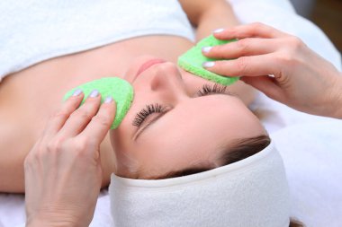 Cleansing peeling at the beauty salon. clipart