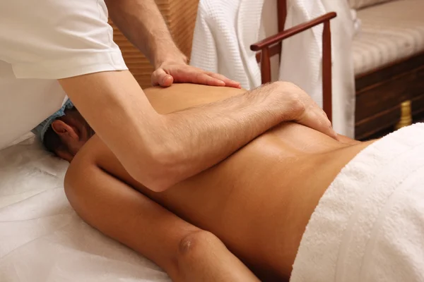 Back massage in the spa salon. — Stock Photo, Image