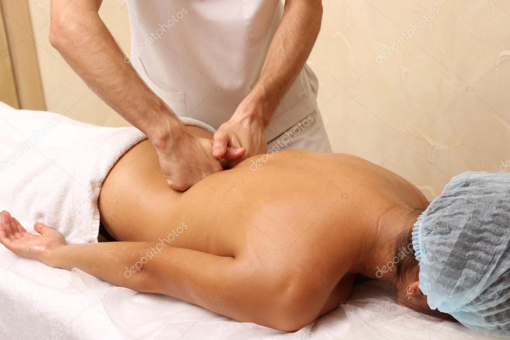 Back massage in the spa salon.