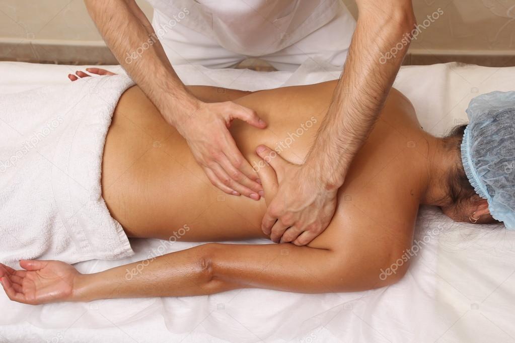Back massage in the spa salon.