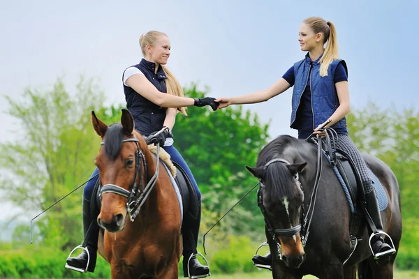 Two young girls - dressage riders with horses — Stock Photo, Image