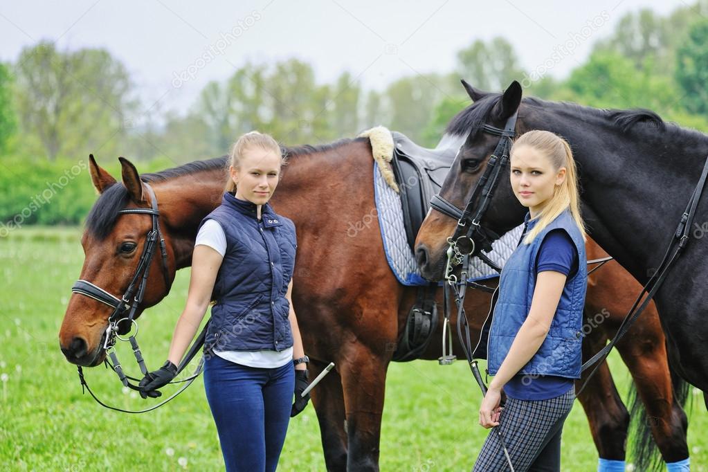 Two young girls - dressage riders with horses