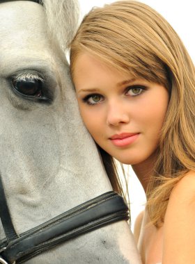 Beautiful young girl and white horse clipart