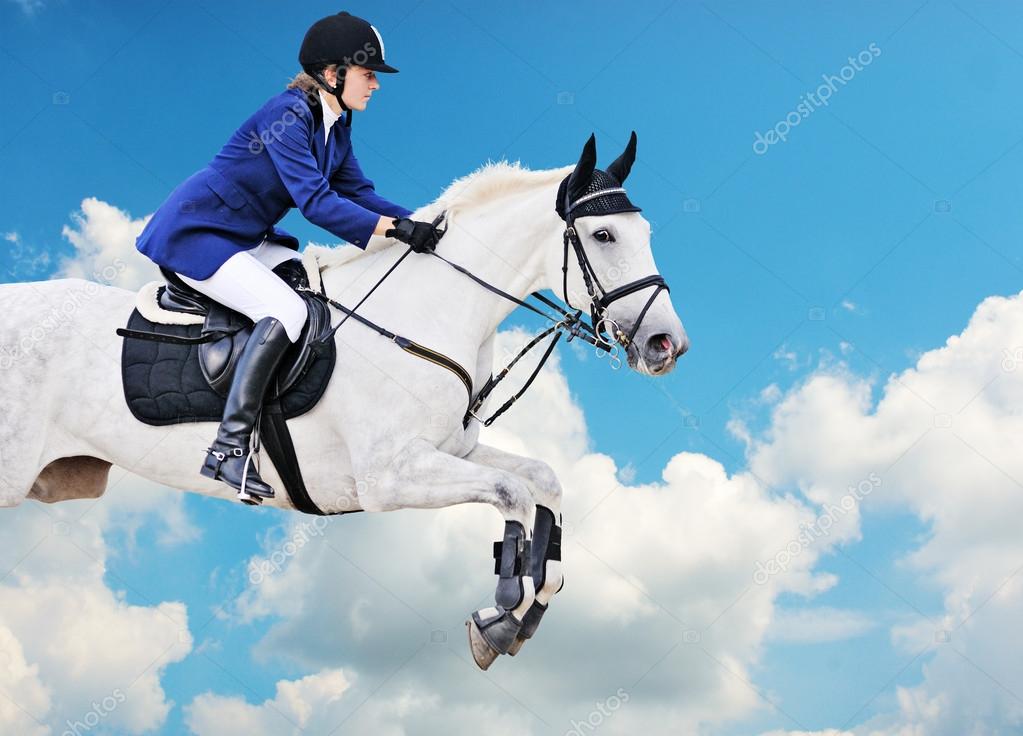Equestrian sport: young girl in jumping show