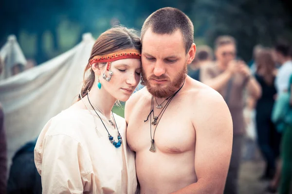 MOSCOW/RUSSIA  JUNE 23: Medieval loving couple posing during the great international festival of historical reconstruction Times and Epochs. Editorial content.