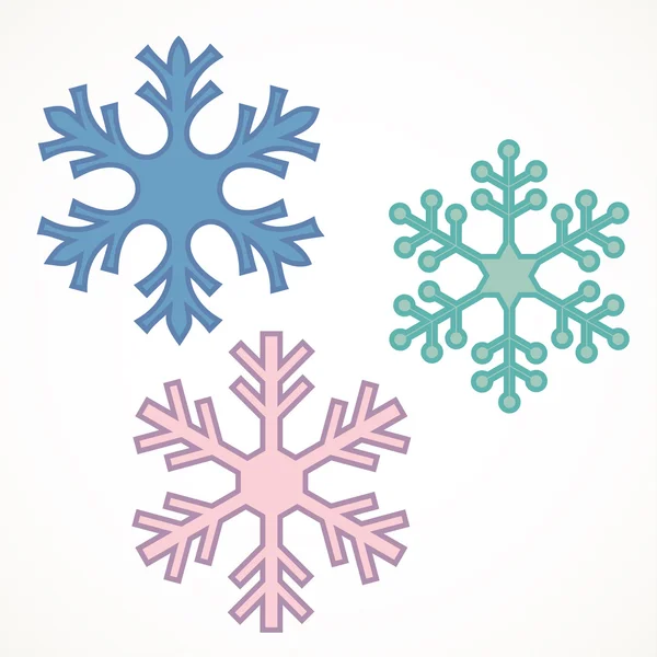 Tre snöflingor över vita — Stock vektor
