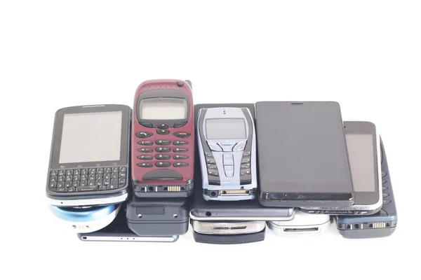 Teléfonos móviles antiguos y nuevos, teléfonos inteligentes —  Fotos de Stock