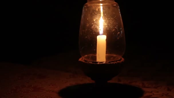 Bright burning candle in the dark — Stock Video