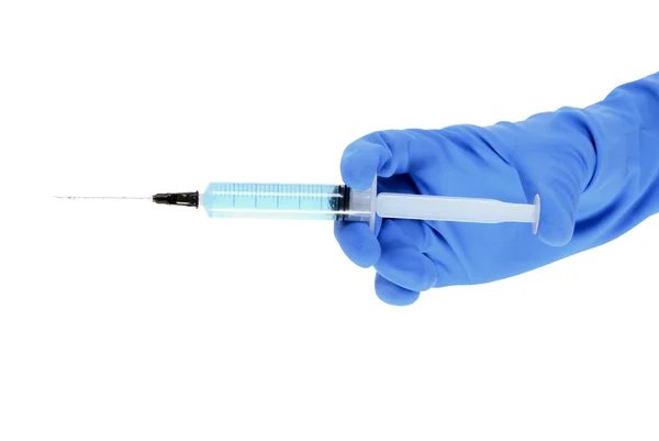 Hand in glove with medical syringe. — Stock Photo, Image