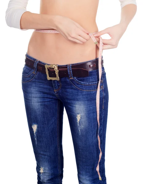 Mujer midiendo su cintura sobre blanco —  Fotos de Stock