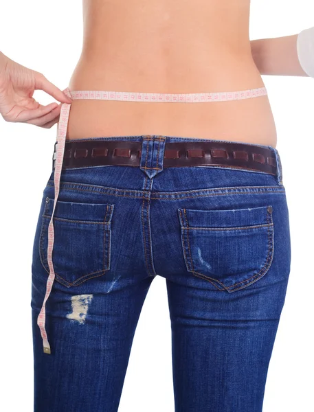 Mujer midiendo su cintura vista trasera sobre blanco — Foto de Stock