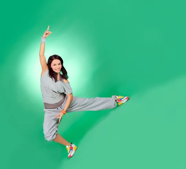 Attractive young female in stretching over green — Stock Photo, Image