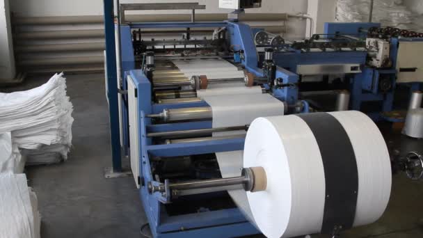 Big polymeric tape roll unreel for a printing press — Stock Video