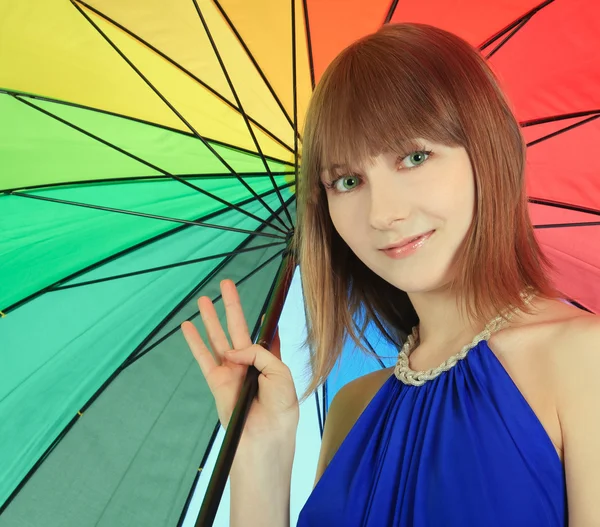 Fashion blondie posing with color umbrella — Stock Photo, Image