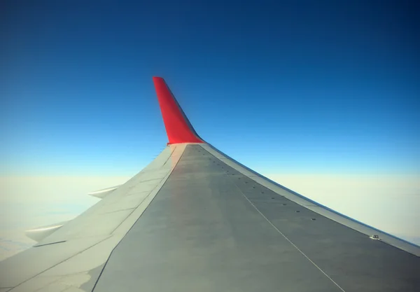 Wing of airplane from window — Stock Photo, Image