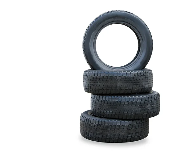 The stack of four winter new tires over white — Stock Photo, Image