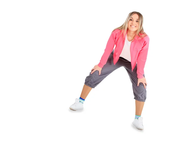 Joven mujer sonriente en ropa deportiva aislada sobre blanco — Foto de Stock