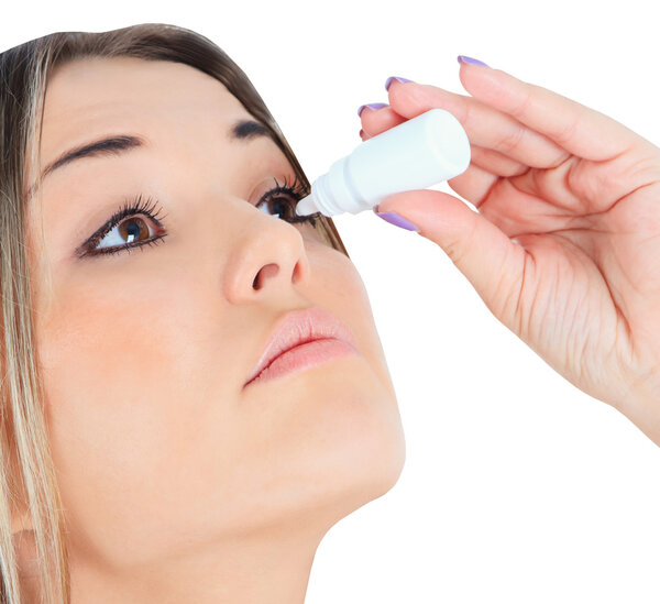 woman dripping eye with eyes drops