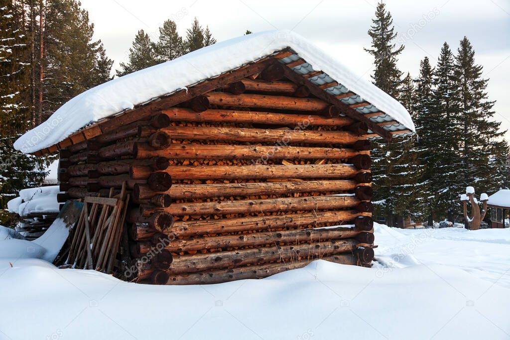 Old barn in a winter forest