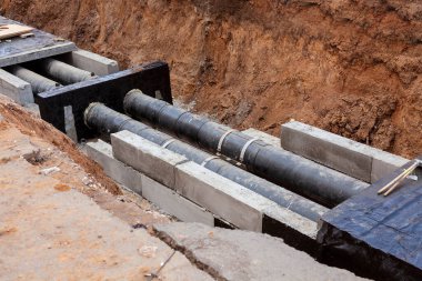 Insulated pipes in the trench. Water main reconstruction and replacement.	