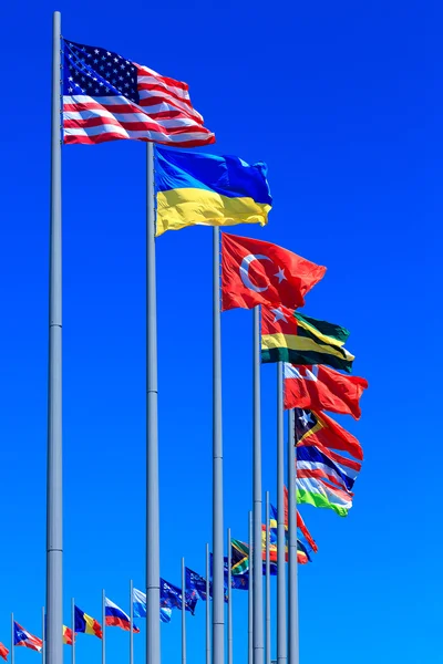Flags against blue sky, copyspace — Stock Photo, Image
