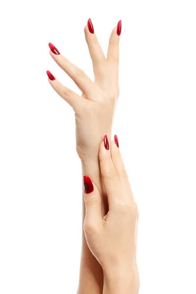 Mãos femininas com unhas vermelhas, fundo branco, isolado — Fotografia de Stock