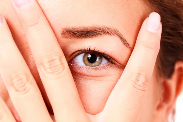 Girl looking between her fingers — Stock Photo, Image