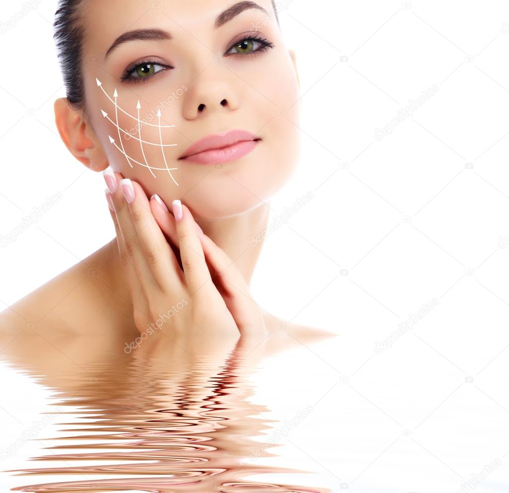 Young female with clean fresh skin, white background