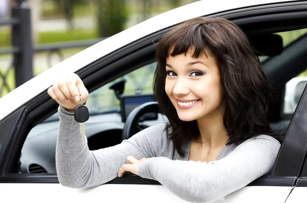 Pretty girl showing the car key — Stock Photo, Image