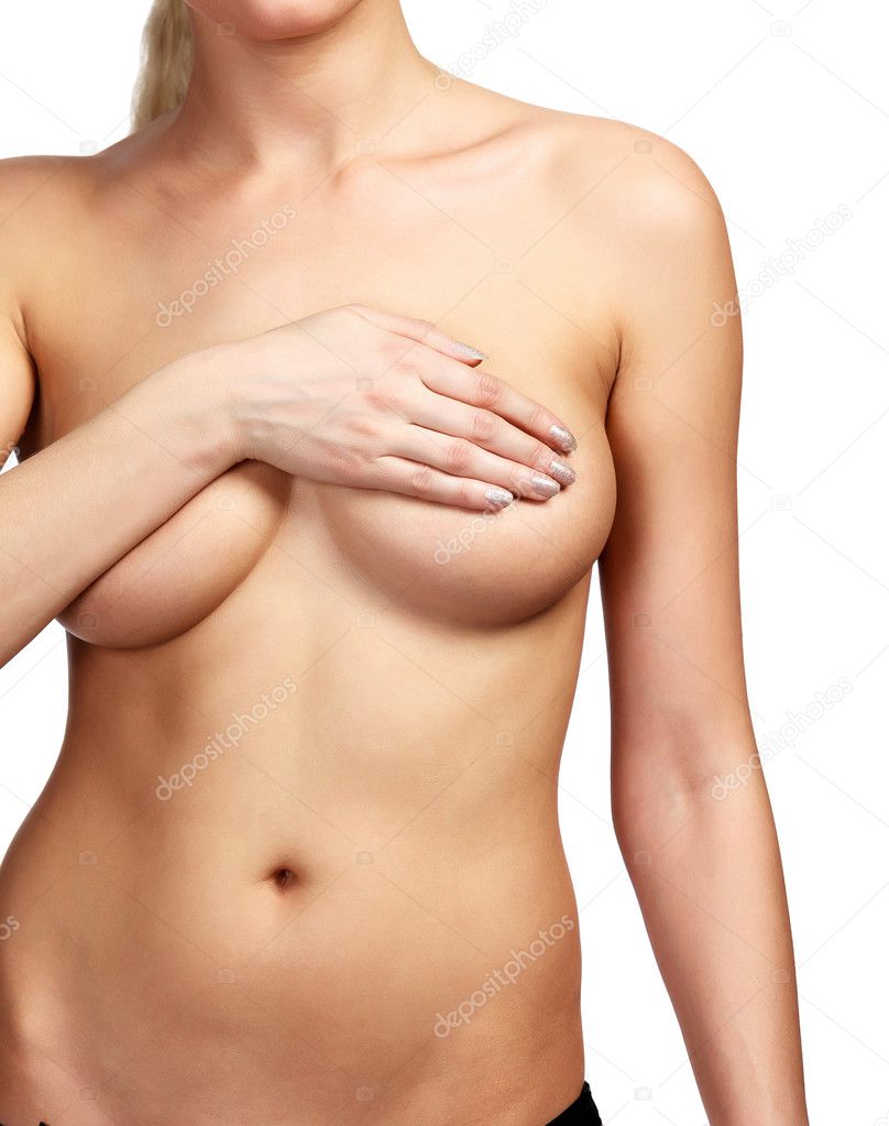 Woman covering her breast with her hands, white background