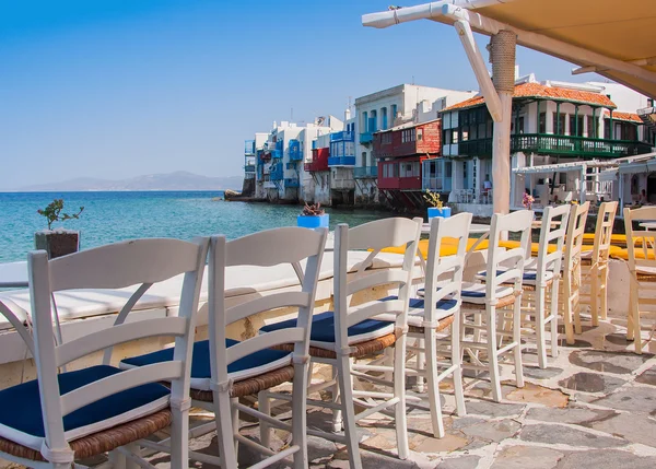 Cafe at Little Venice at sunset. Mykonos. Greece. — Stock Photo, Image