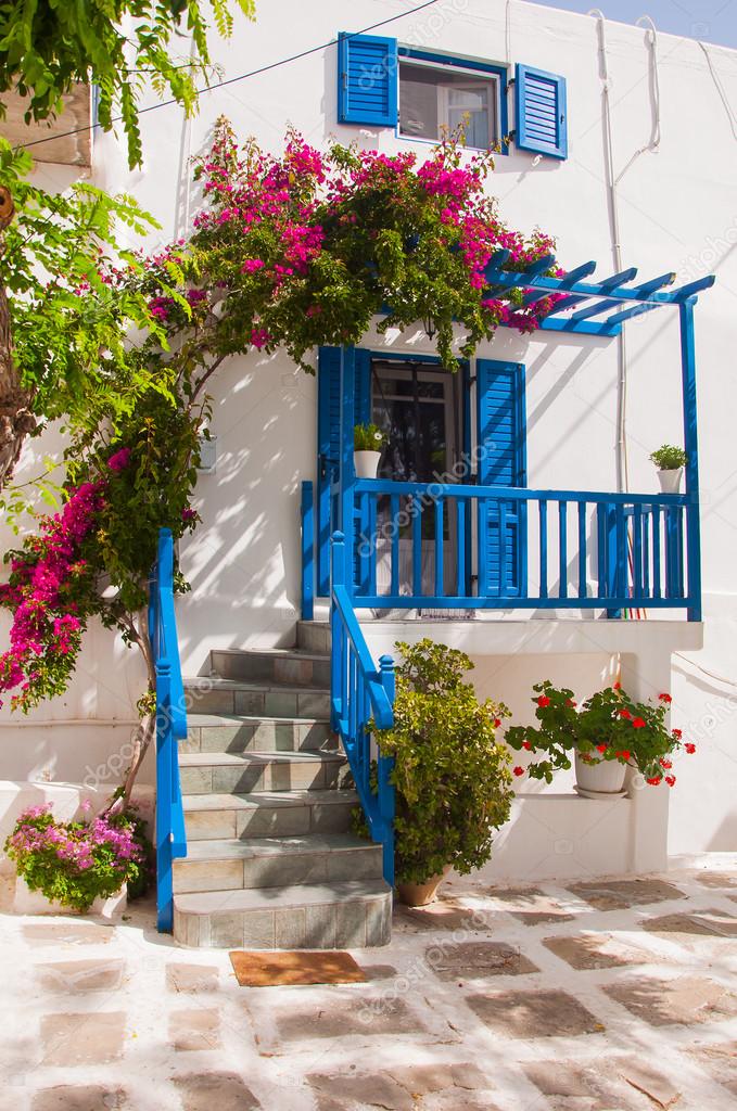 Bougainvillea flowers around a house with a balcony. Mykonos. Stock ...