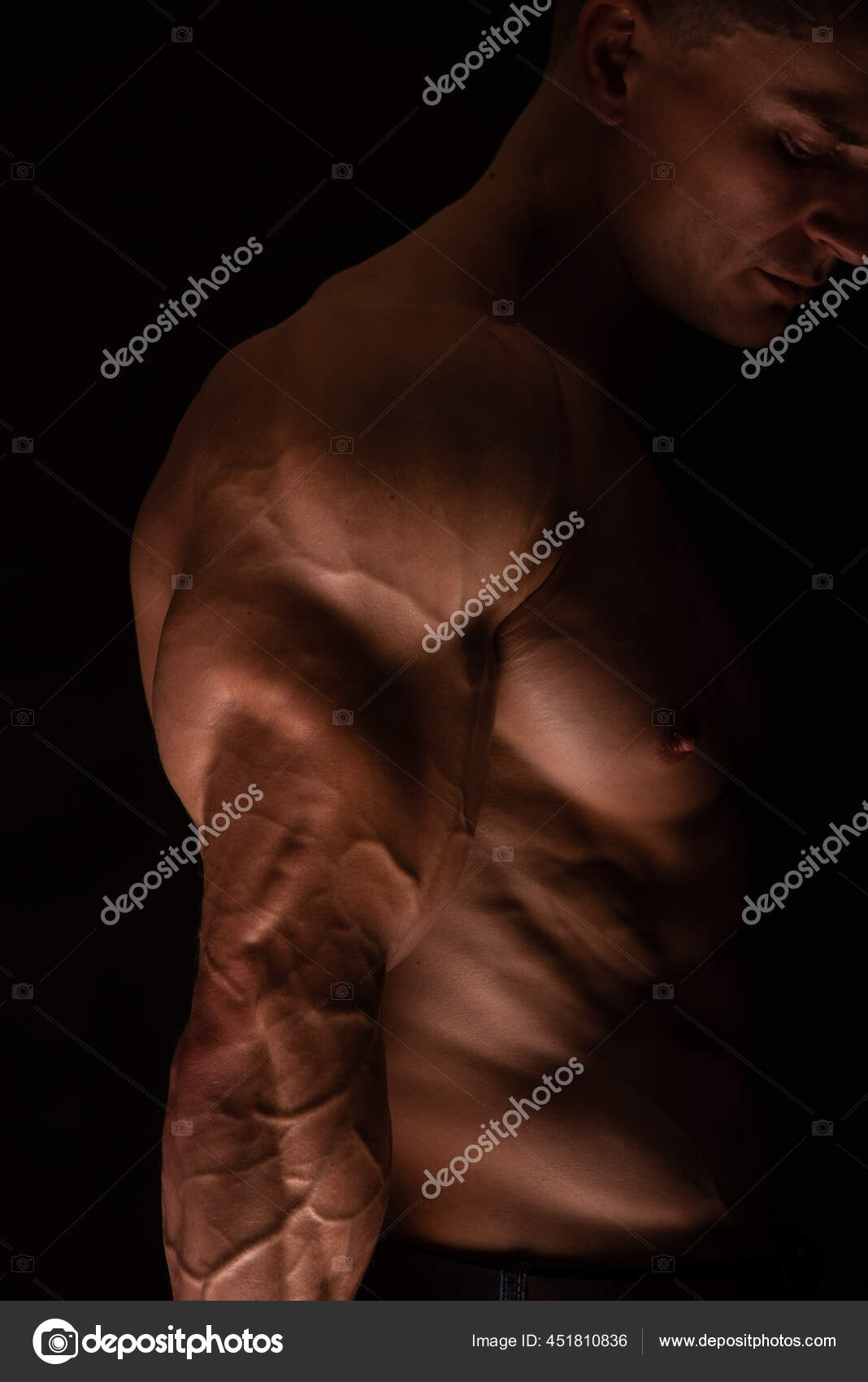 Muscled Male Model Flexing Triceps Stock Photo by ©vishstudio 451810836