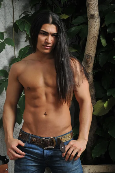 Male model in tropical greenhouse — Stock Photo, Image