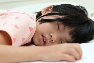 Asian child sleeping clipart