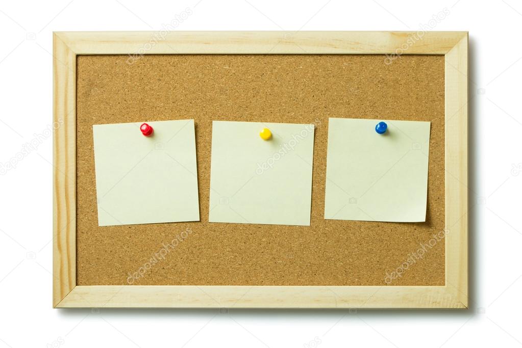 Blank post it notes on a cork notice board