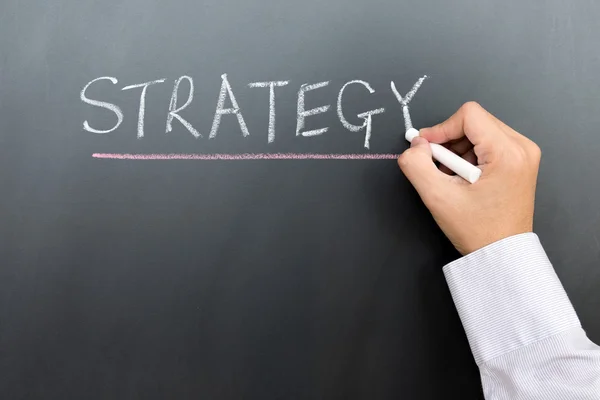 Strategy written on blackboard — Stock Photo, Image