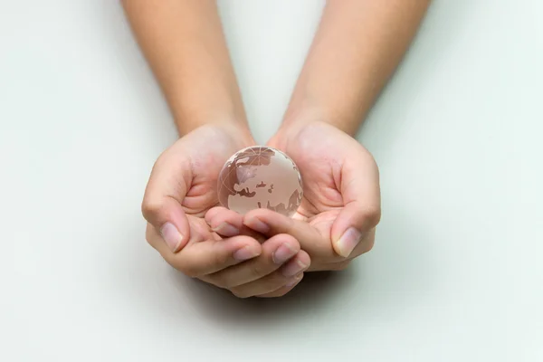 Crystal earth in hand — Stock Photo, Image