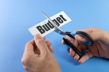 Budget cutting with scissor clipart