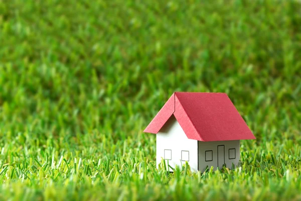 House on green field — Stock Photo, Image